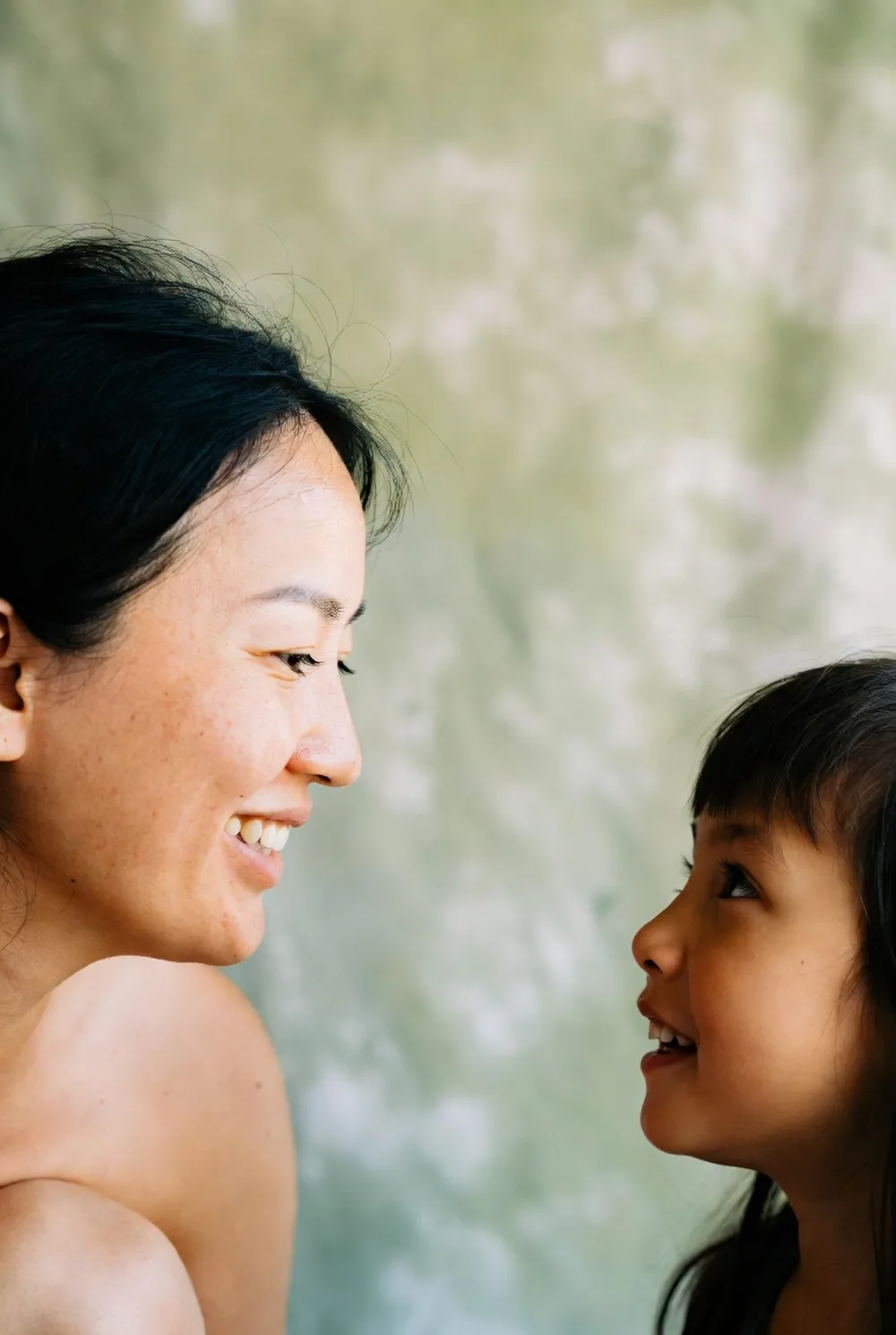 A mother and daughter together, warm and candid